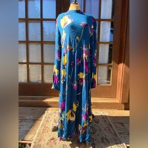 Dress in beautiful colors . Nice material in skin .Almost maxi .